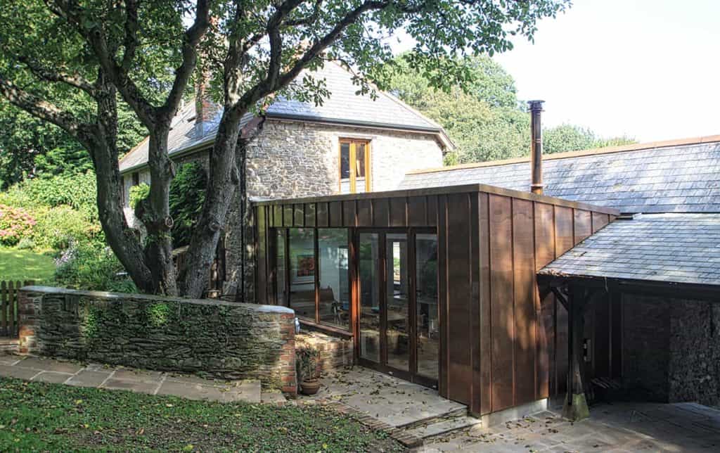 Old tree infront of contemporary dining room