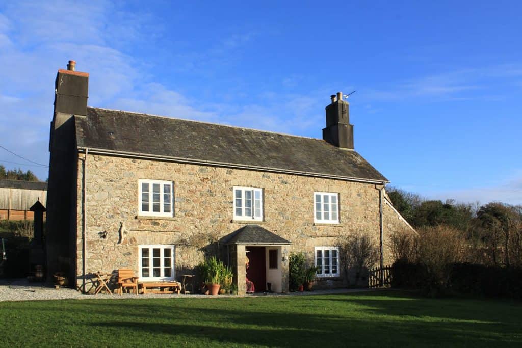 Dartmoor Moor Farmhouse with sun going down