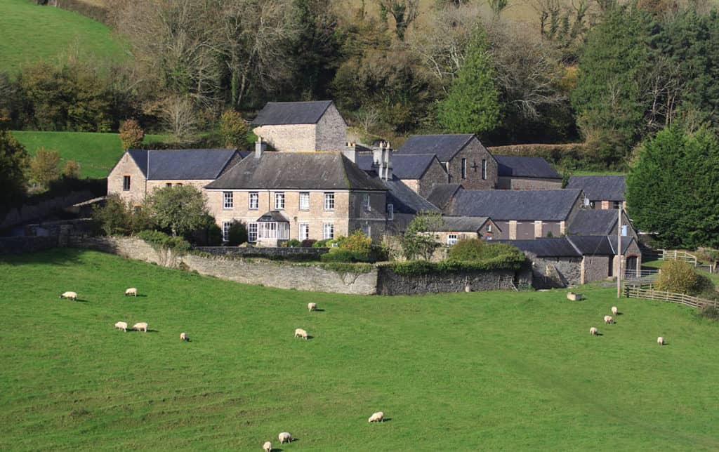 Group of stone farmhouses and barns on the Edmeston Estate in Devon
