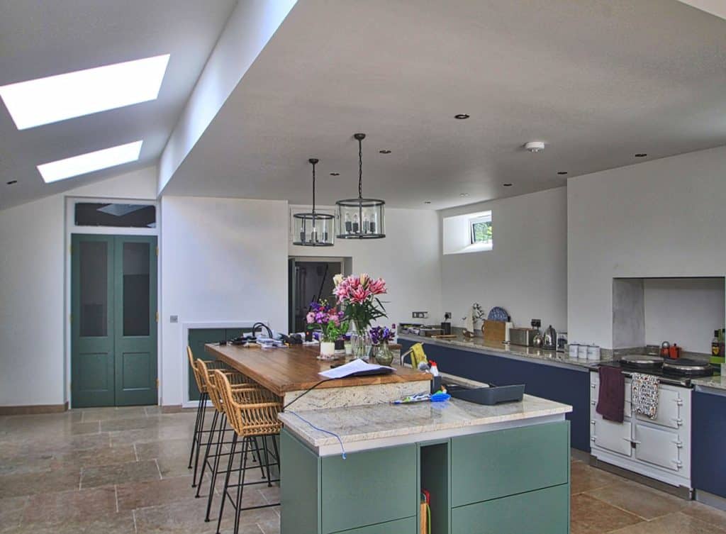 Georgian Townhouse kitchen with green doors and blue units, white aga