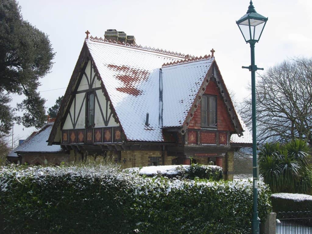 Victorian Architecture on Gatehouse of park in snow