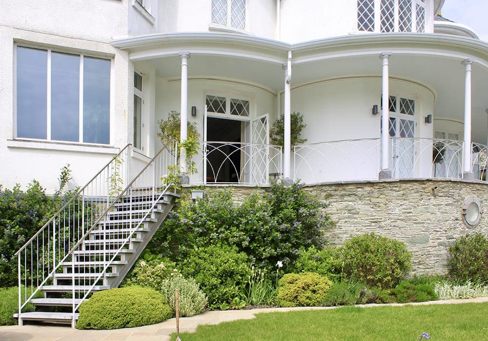 Limestone steps leading up to house on cliff in Salcombe