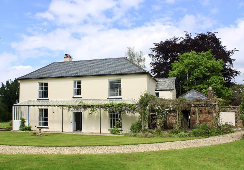 heritage management plans,sixteenth century thatched cottage,devon,reed thatch,lime renders,scantle slate,sash window joinery,ornate ironwork