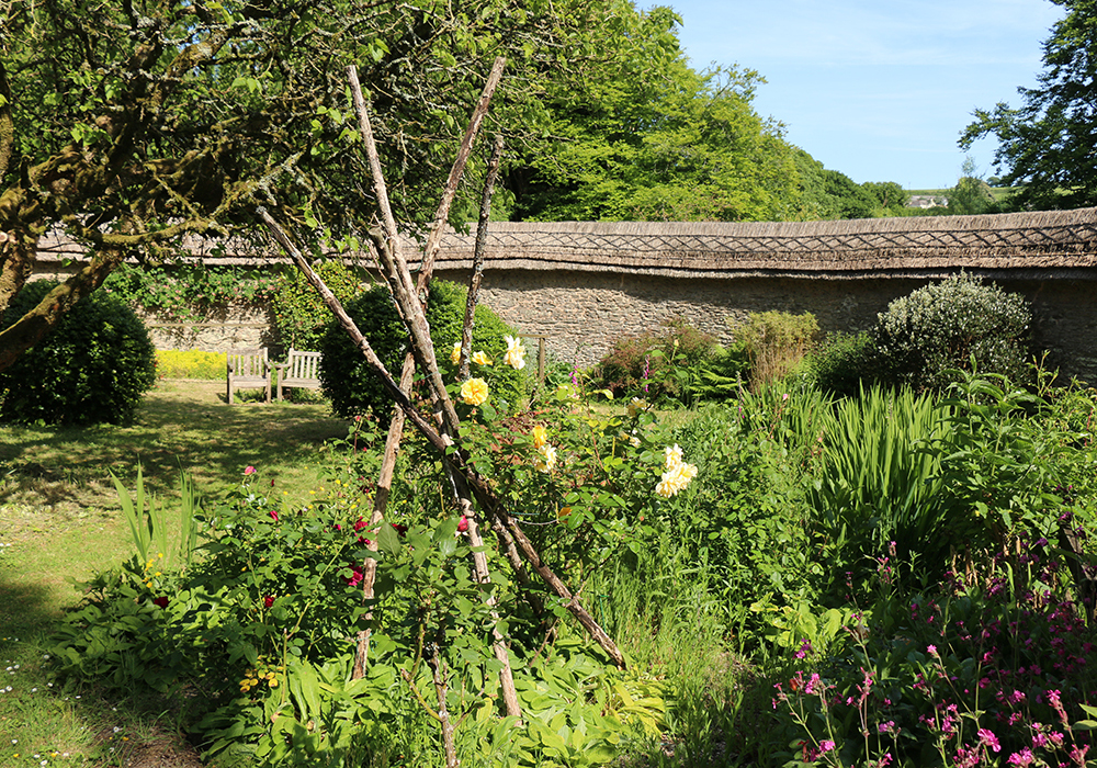 historic garden restoration Devon,listed building architects UK,17th century kitchen garden,thatched wall coping,heritage architecture South Hams,Atkinson Architects projects,Alleron House,Loddiswell,Circular Walled Garden,leat